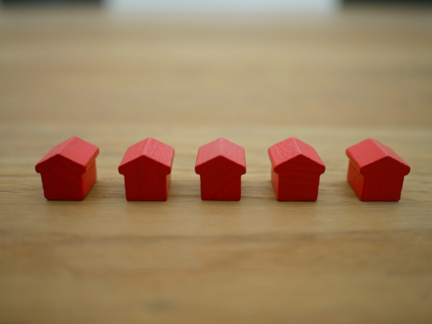 five red toy homes