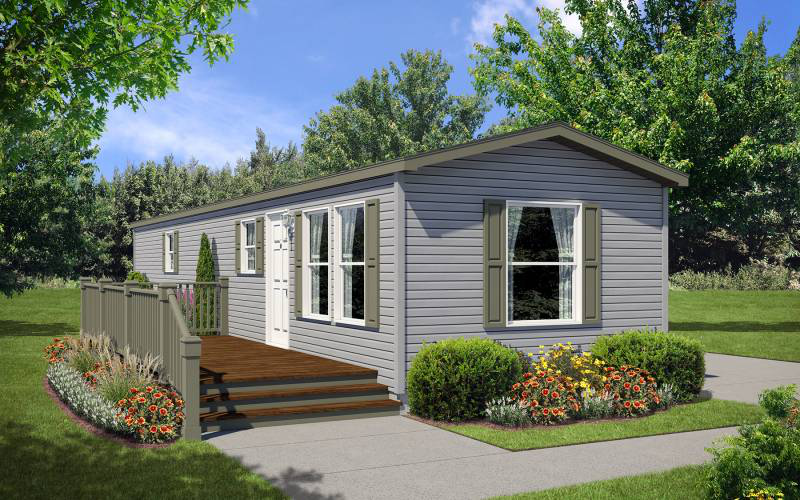 A modern manufactured home with clean lines, siding, and a landscaped front yard