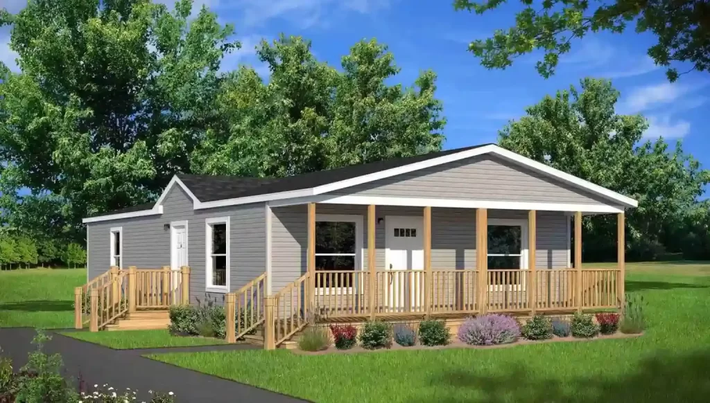 This image shows a modern, single-story house with a porch and surrounding greenery.