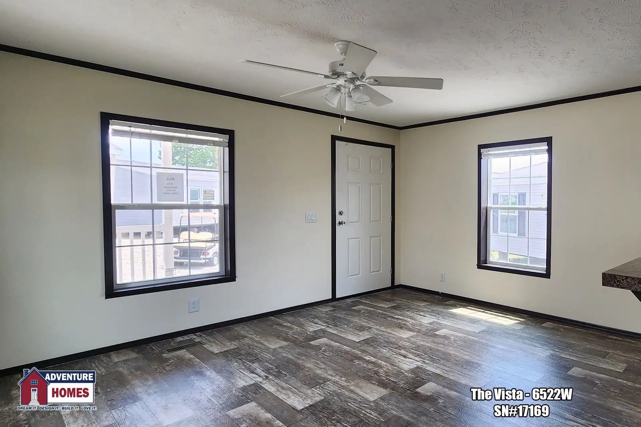 a bright open air hallway with big windows